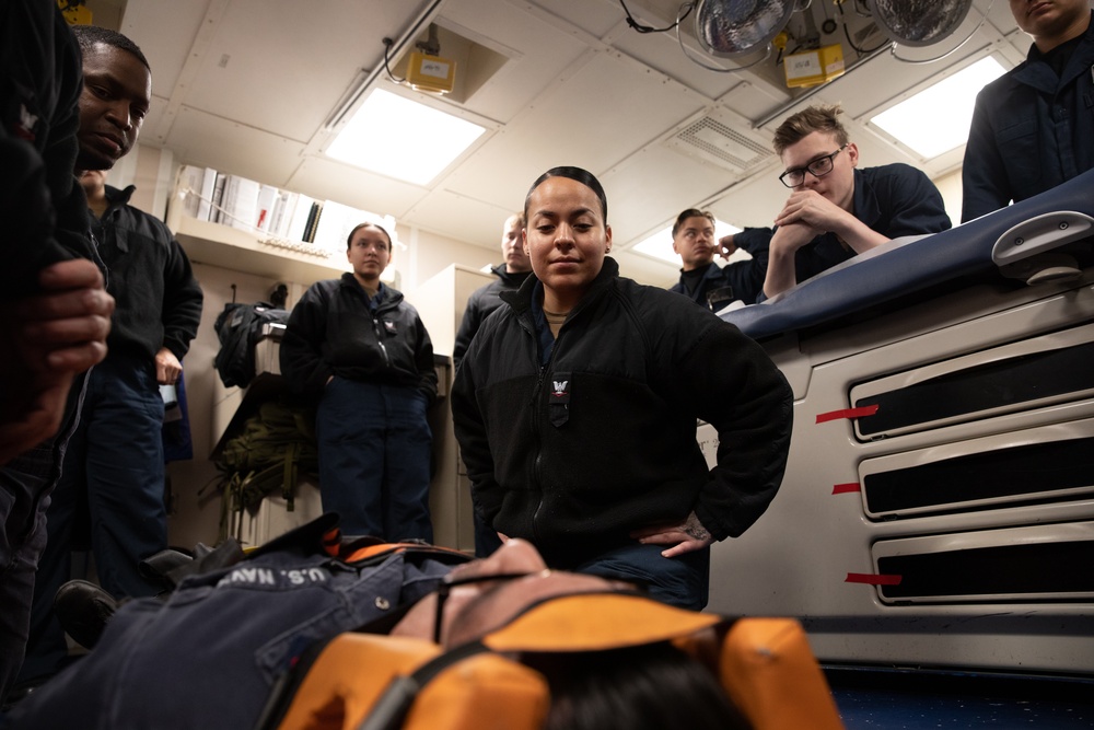 Hospital Corpsman 3rd Class Jennifer Artalejo gives stretcher bearer training