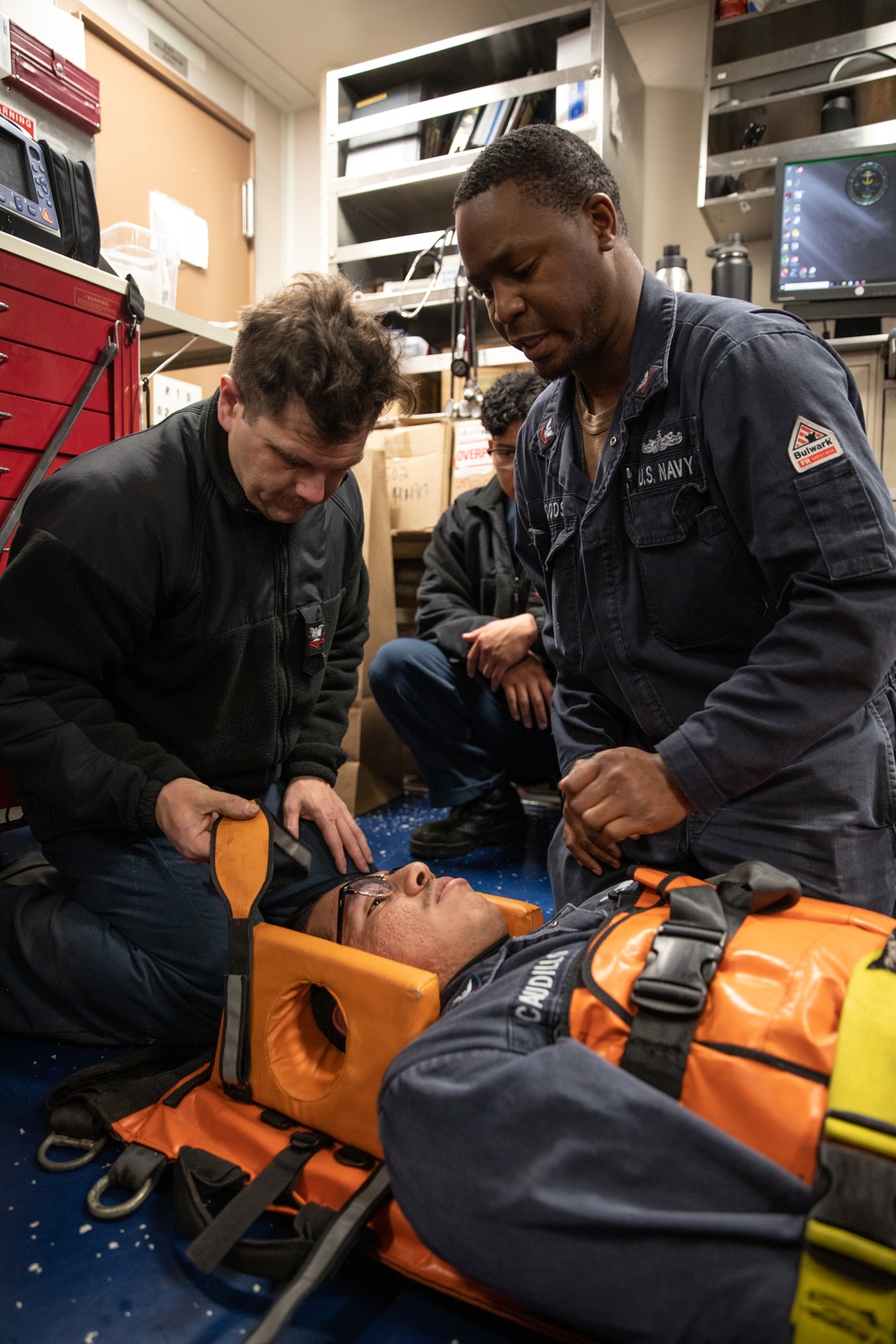 Operations Specialist 2nd Class Jefferson Walker participates in stretcher bearer training