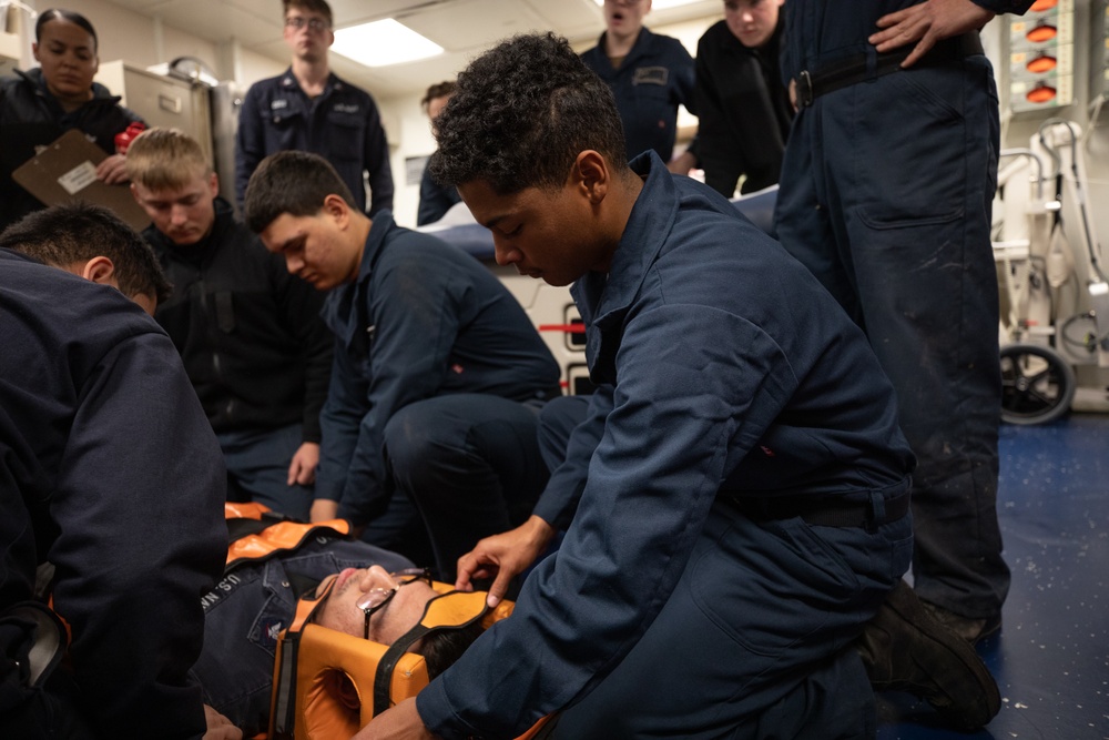 Boatswain's Mate Seaman Alexis Wallace participates in stretcher bearer training