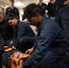 Boatswain's Mate Seaman Alexis Wallace participates in stretcher bearer training