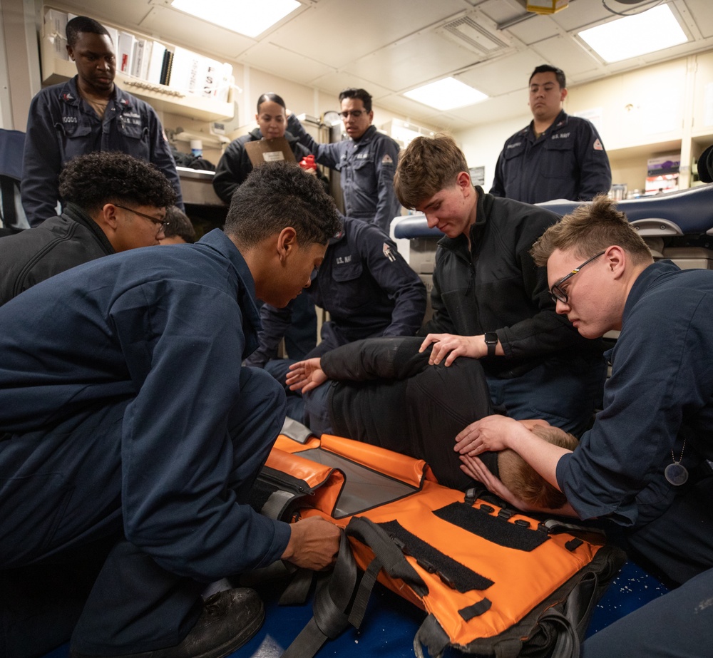 USS Harpers Ferry (LSD 49) sailors participate in stretcher bearer training