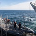 USS Harpers Ferry (LSD 49) sailors sail on rigid hull inflatable boat (RHIB)