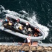 USS Harpers Ferry (LSD 49) sailors climb into rigid hull inflatable boat (RHIB)