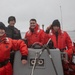 USS Harpers Ferry (LSD 49) sailors follow ship into port in Kodiak, Alaska