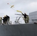 Arleigh Burke-class guided-missile destroyer USS Momsen (DDG 92) pulls into port at Homer, Alaska