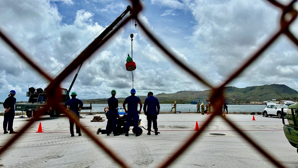 Joint team refloat and relocate aids to navigation in inner Apra Harbor