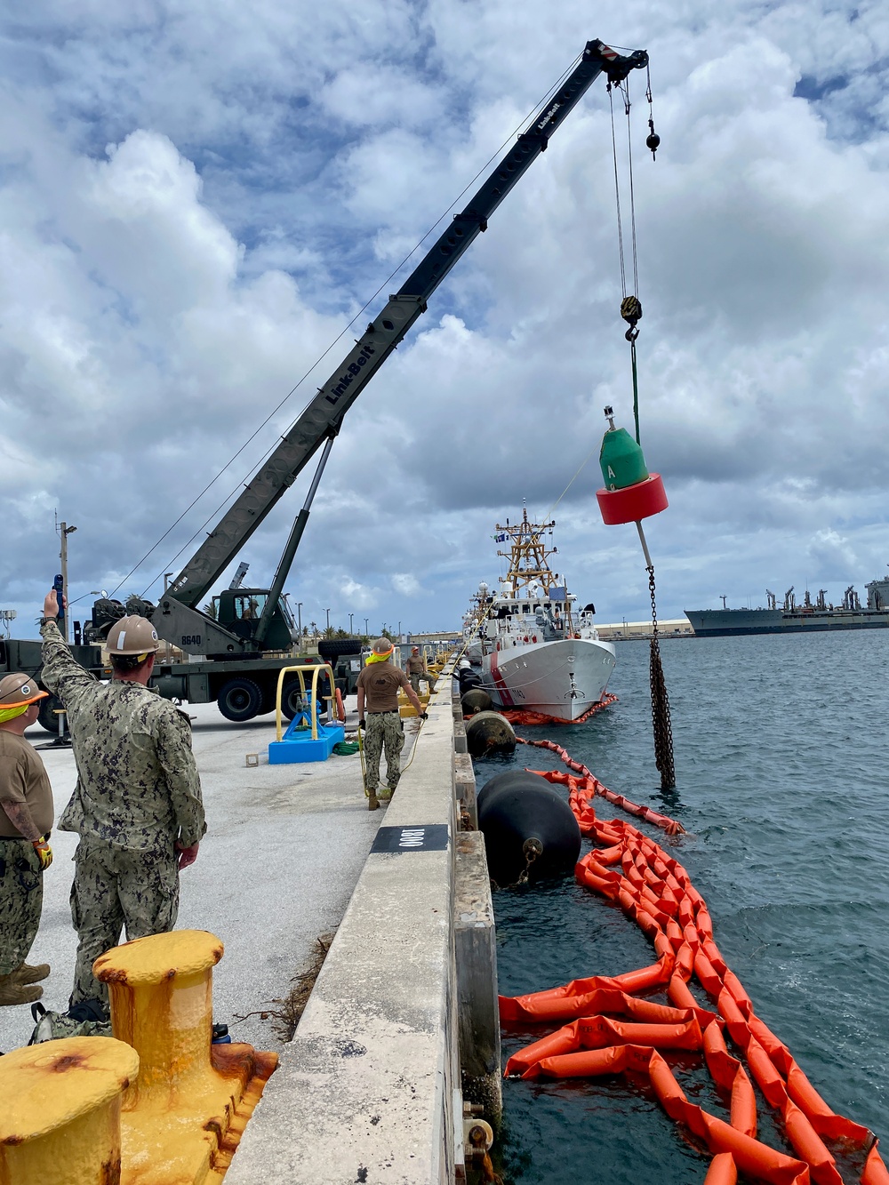 Joint team refloat and relocate aids to navigation in inner Apra Harbor