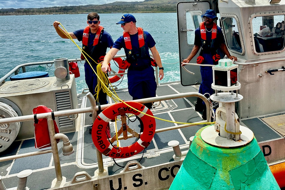 Joint team refloat and relocate aids to navigation in inner Apra Harbor