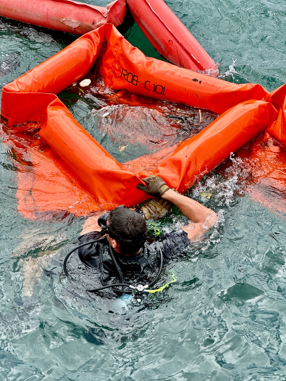 Joint team refloat and relocate aids to navigation in inner Apra Harbor