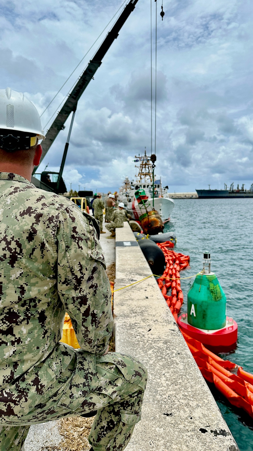 Joint team refloat and relocate aids to navigation in inner Apra Harbor