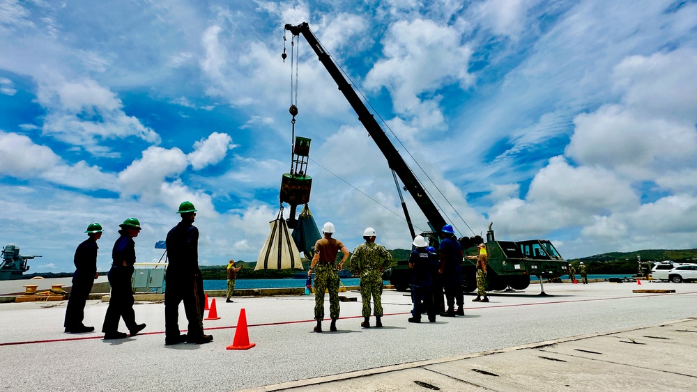 Joint team refloat and relocate aids to navigation in inner Apra Harbor