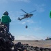 USS Ronald Reagan (CVN 76) conducts vertical replenishment (VERTREP) with USNS Wally Schirra