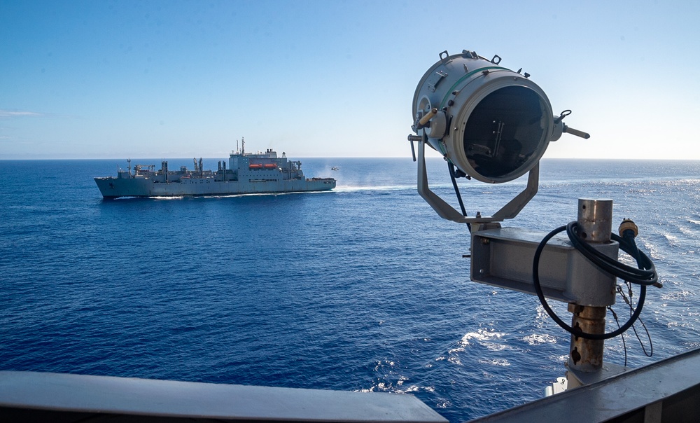 USS Ronald Reagan (CVN 76) conducts vertical replenishment (VERTREP) with USNS Wally Schirra