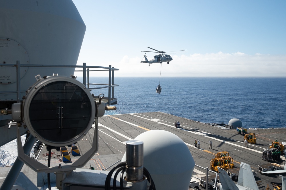 USS Ronald Reagan (CVN 76) conducts vertical replenishment (VERTREP) with USNS Wally Schirra