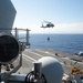 USS Ronald Reagan (CVN 76) conducts vertical replenishment (VERTREP) with USNS Wally Schirra