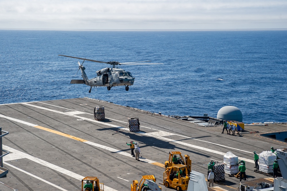 USS Ronald Reagan (CVN 76) conducts vertical replenishment (VERTREP) with USNS Wally Schirra