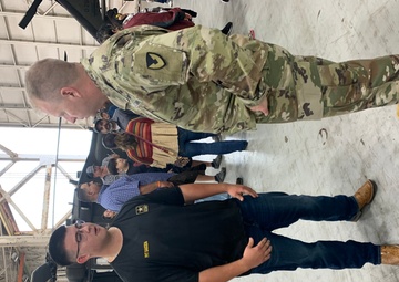 High school students enlist in Army during ceremony at depot