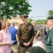 Lieutenant Colonel Trent Colestock and Mrs. Betty Gordon, Gary Gordon's mother, speaking before the ceremony