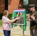 Mrs. Betty Gordon and LTC Trent Colestock unveil the plaque for Gordon Hall.