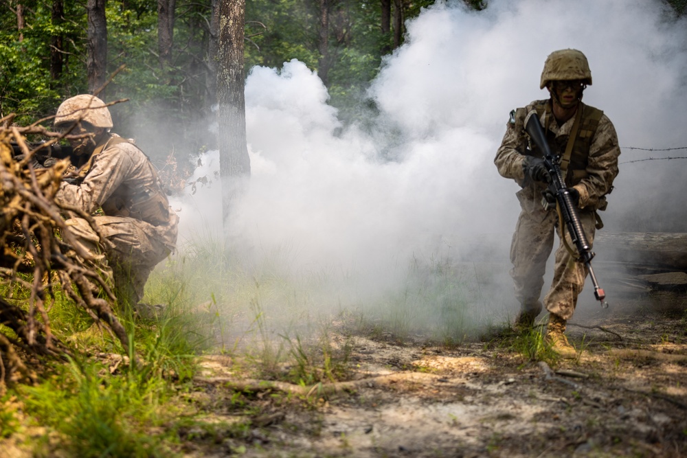 OCS Candidates Conduct the Fire Team Assault Course