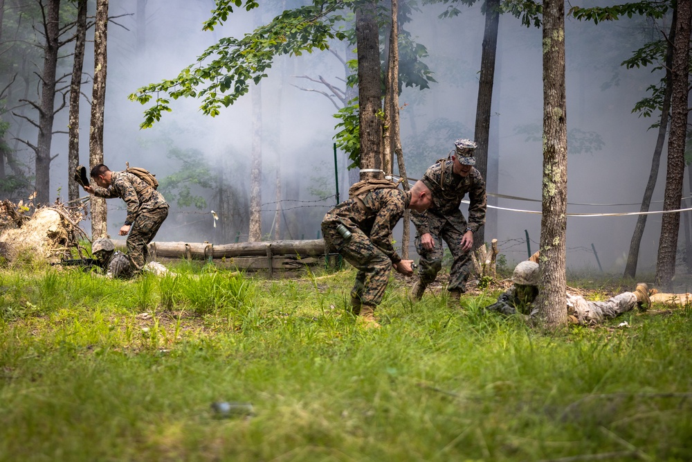 OCS Candidates Conduct the Fire Team Assault Course