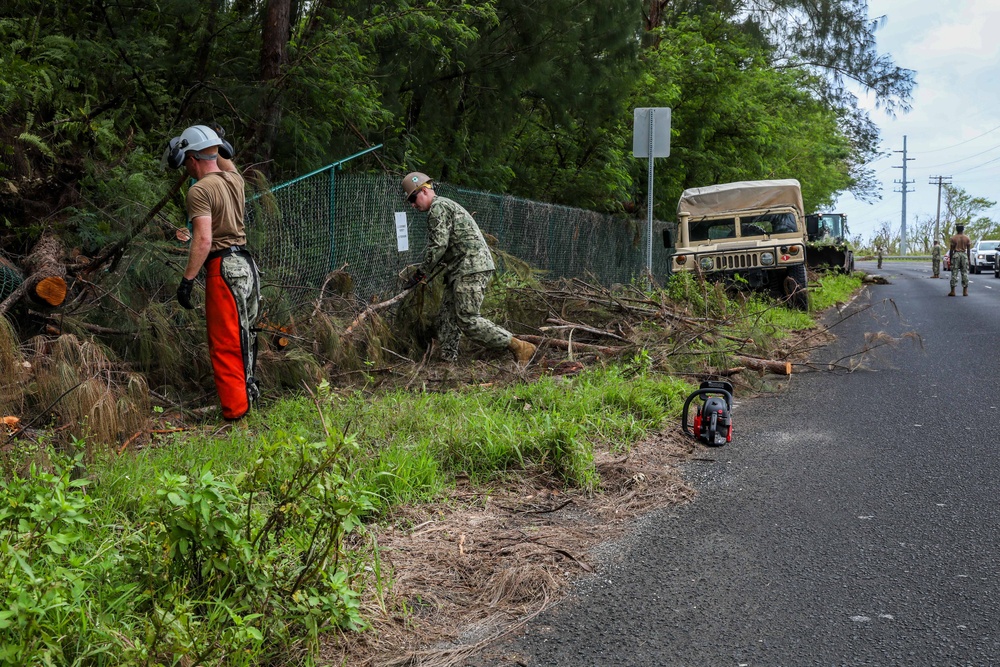 Seabees from Combined Task Force 75 translocate debris felled by Typhoon Mawar in Guam