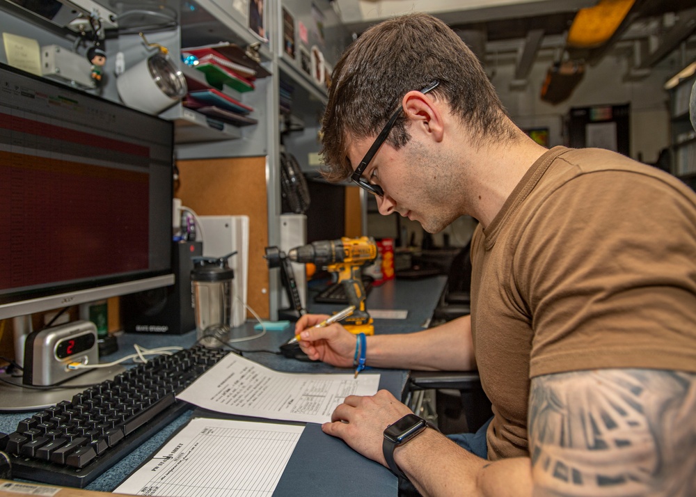 Sailor Works At Desk