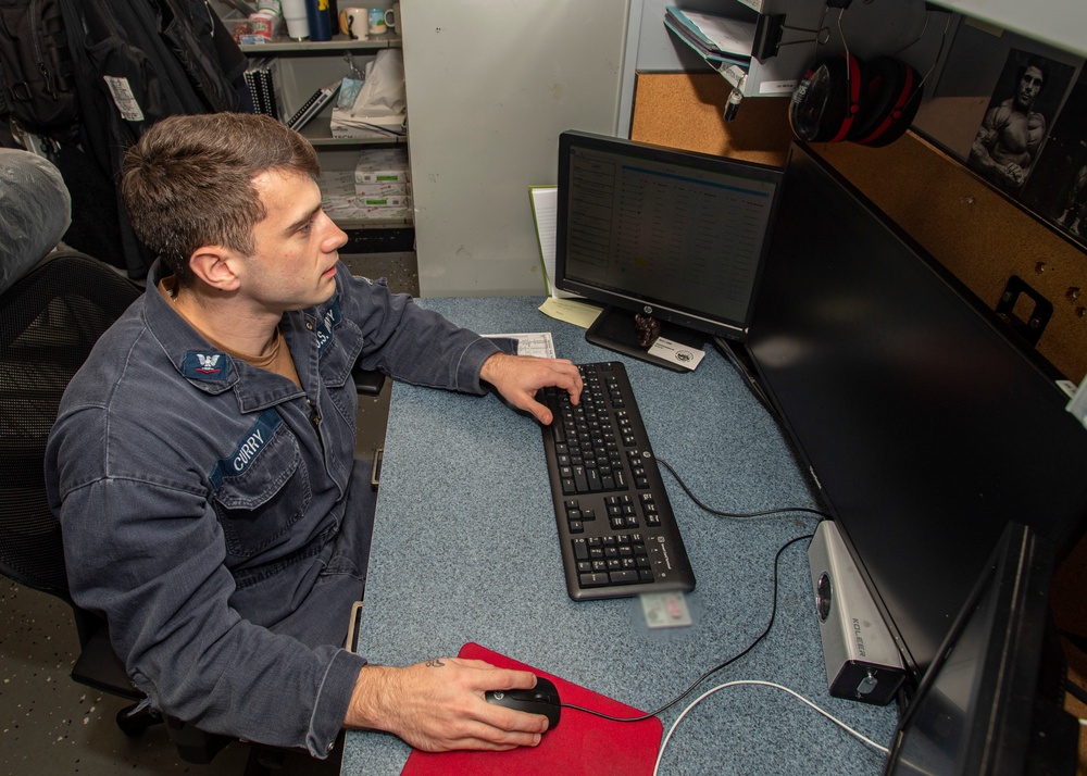 Sailor Works At Desk