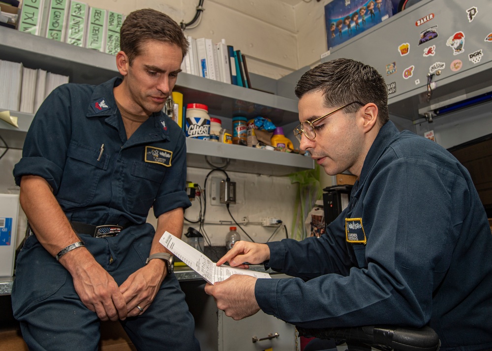 Sailors Work On Paperwork