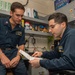 Sailors Work On Paperwork