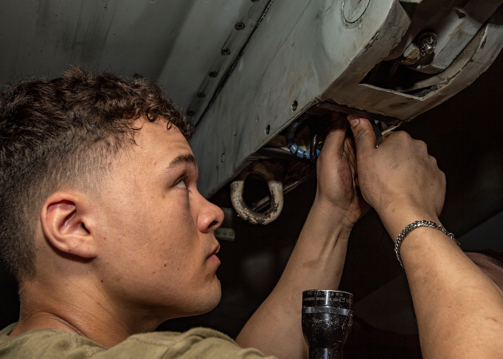 Sailor Conducts Maintenance