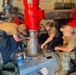 ESL Sailors Work on Fire Pump