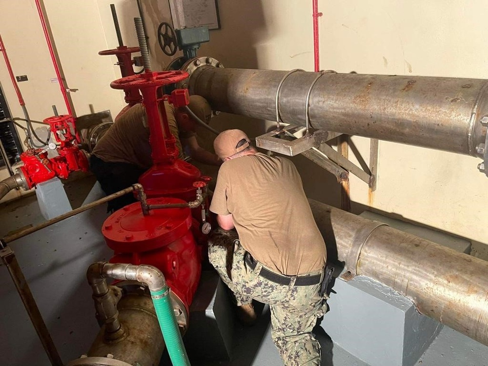 ESL Sailors Work on Fire Pump