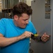ESl Sailors Assess AC Unit on Anderson AFB