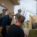 ESl Sailors Assess AC Unit on Anderson AFB