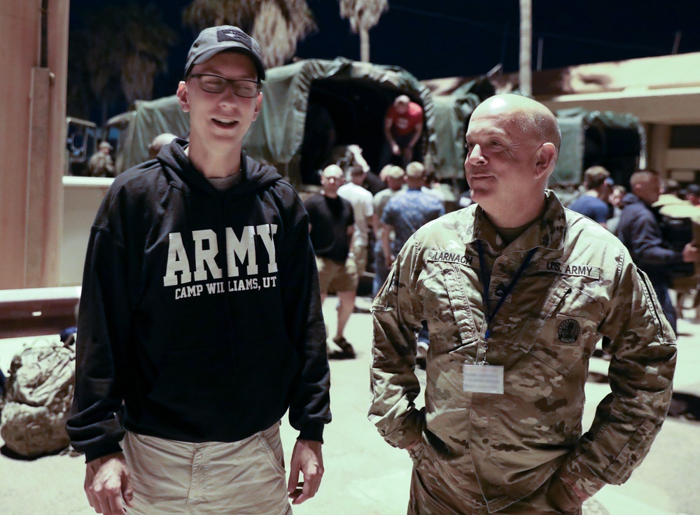 StrongerTogether  Father and Son Meet During Exercise African Lion