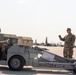 U.S. Airmen work together near the flight Line at exercise Air Defender 2023