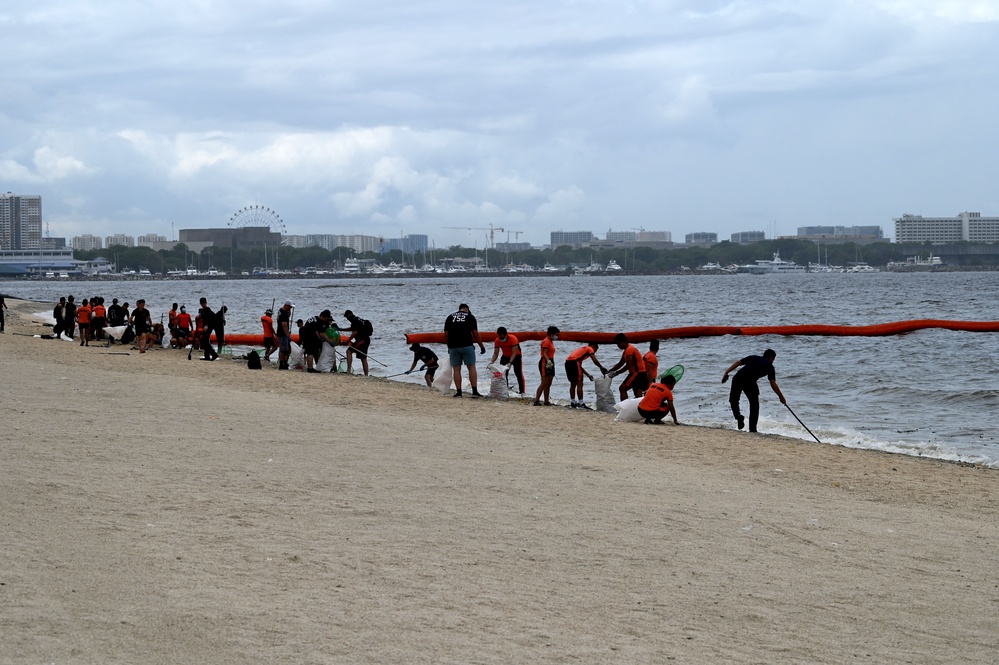 U.S., Japan and Philippine Coast Guard servicemembers conduct beach cleanup in Manila