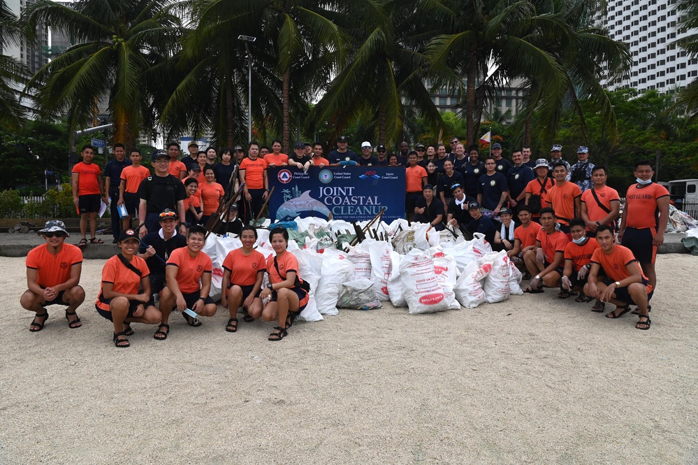 U.S., Japan and Philippine Coast Guard servicemembers conduct beach cleanup in Manila