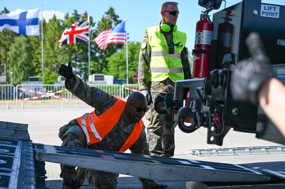 Air National Guard C-130 Hercules aircraft deliver cargo in preparation for exercise Air Defender 2023