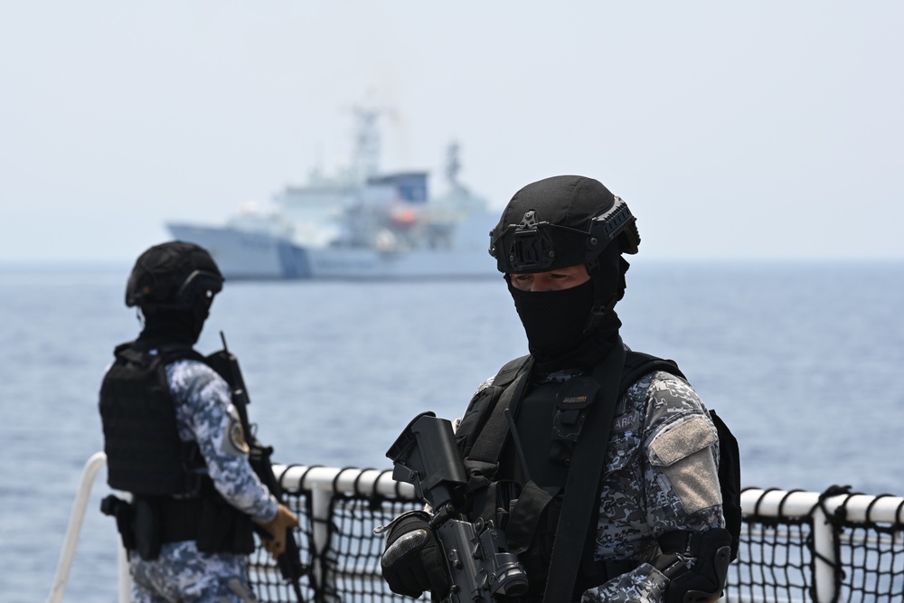 Philippine, Japan and U.S. Coast Guards participate in simulated law enforcement scenario during trilateral engagements in South China Sea