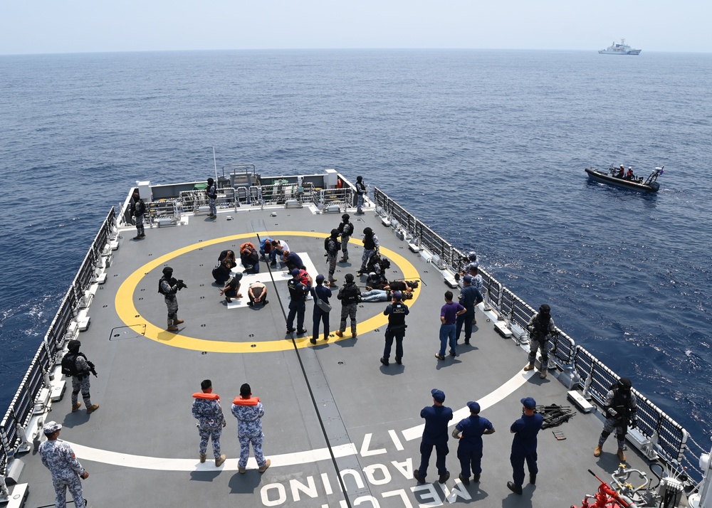 Philippine, Japan and U.S. Coast Guards participate in simulated law enforcement scenario during trilateral engagements in South China Sea