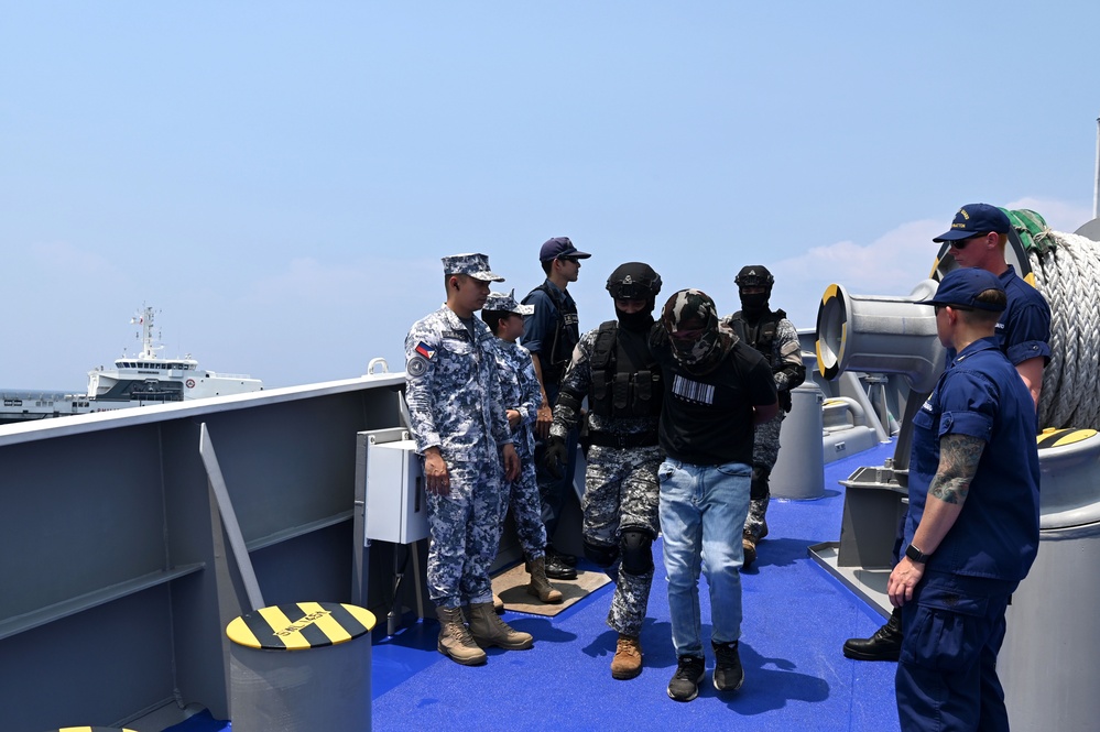 Philippine, Japan and U.S. Coast Guards participate in simulated law enforcement scenario during trilateral engagements in South China Sea