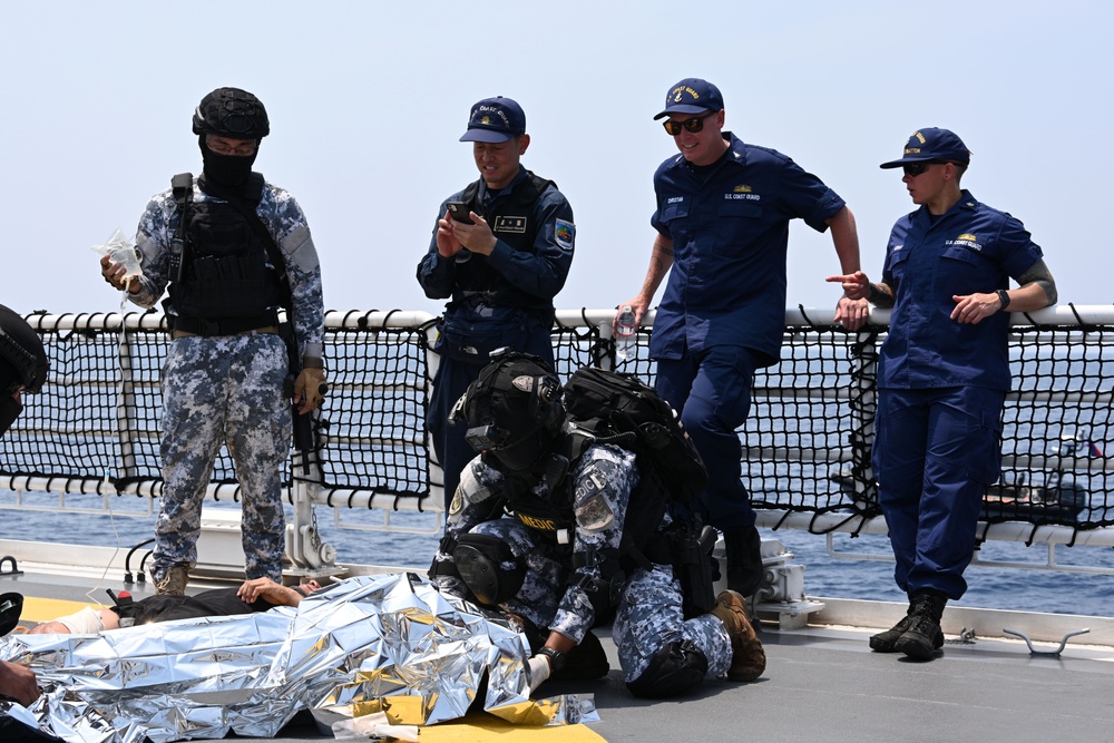 Philippine, Japan and U.S. Coast Guards participate in simulated law enforcement scenario during trilateral engagements in South China Sea