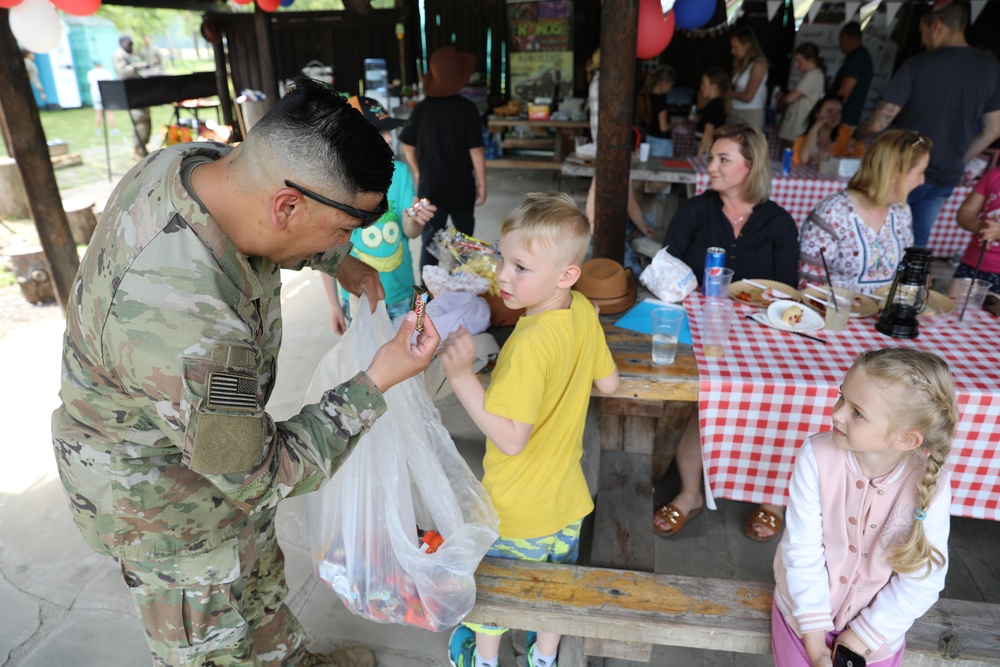 4th Infantry Division Soldiers participate in a cookout with students at an English language school in Boleslawiec, Poland