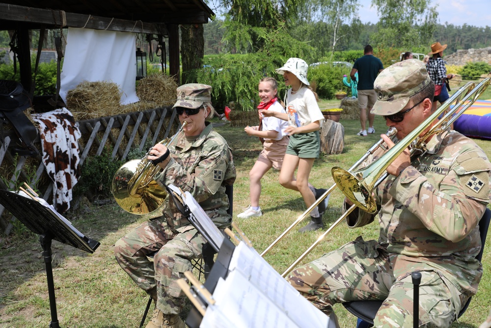 4th Infantry Division Soldiers participate in a cookout with students at an English language school in Boleslawiec, Poland