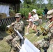 4th Infantry Division Soldiers participate in a cookout with students at an English language school in Boleslawiec, Poland