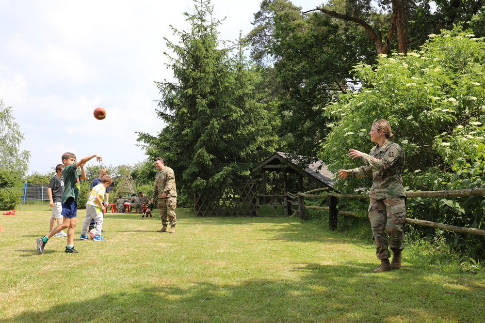 4th Infantry Division Soldiers participate in a cookout with students at an English language school in Boleslawiec, Poland