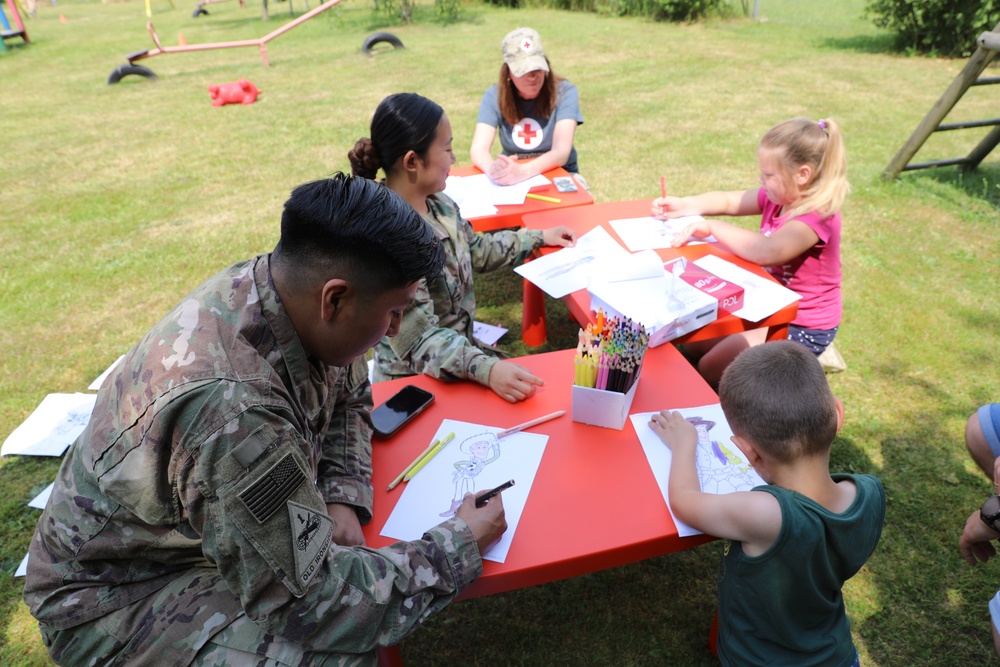 4th Infantry Division Soldiers participate in a cookout with students at an English language school in Boleslawiec, Poland