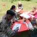 4th Infantry Division Soldiers participate in a cookout with students at an English language school in Boleslawiec, Poland